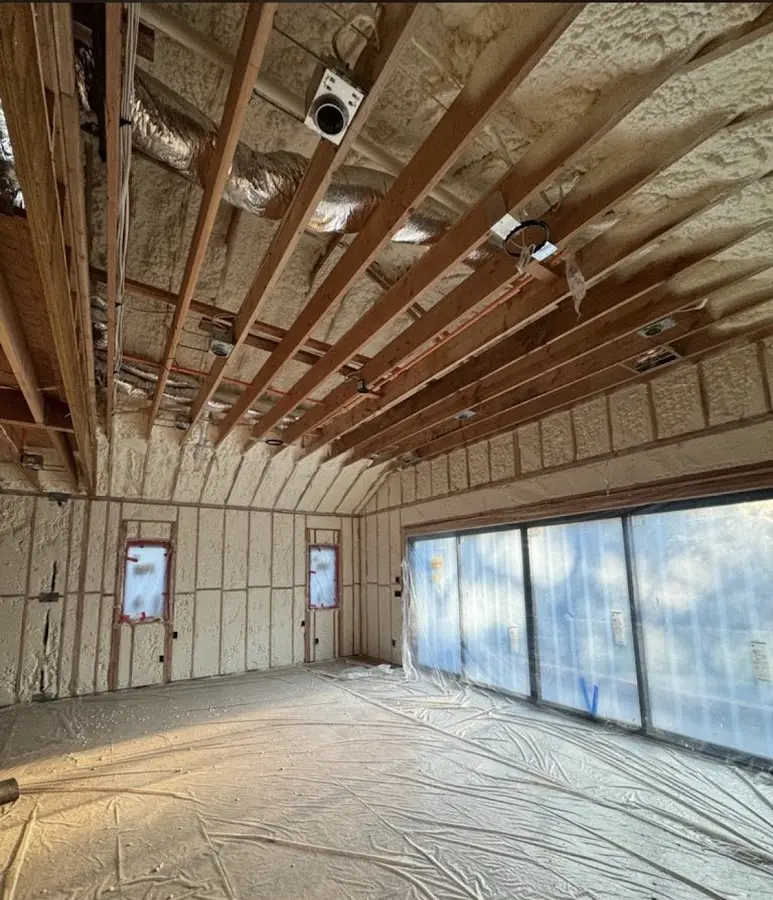 Interior walls and ceiling insulated with spray foam during new construction in Algonquin